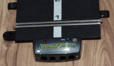 Why are there two power inputs on a Scalextric Sport Powerbase C8217?
