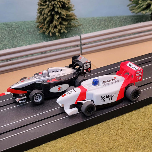 Micro Scalextric Pair 1:64 Cars - F1 Black Mobil #9 & Red White McLaren #8