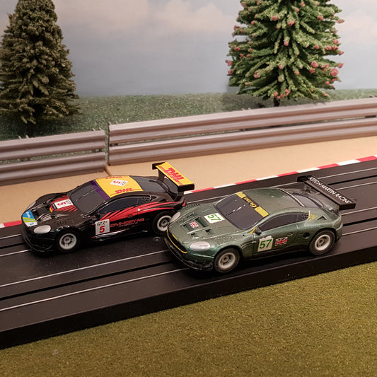 Micro Scalextric Pair 1:64 Cars - Aston Martin DBR9 DHL #5 & #57