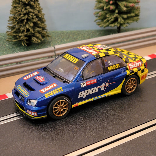 Scalextric 1:32 Car - C2550 Subaru WRC The Sun #131 *LIGHTS* #FWMS